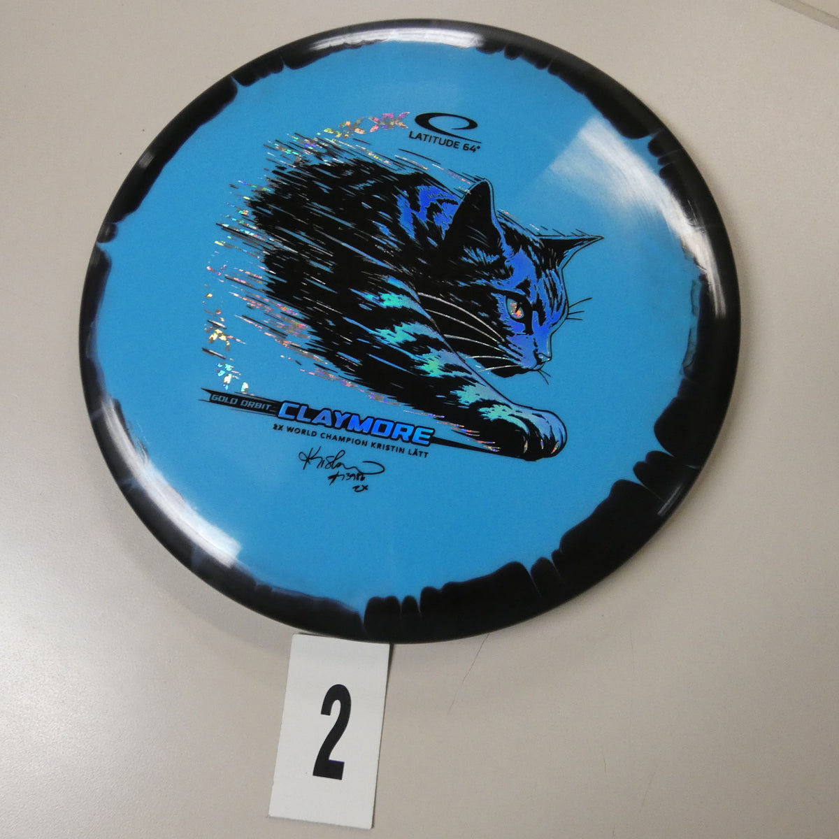 Kristin Latt Gold Orbit Claymore (2026)